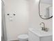 Simple bathroom with white vanity and oval mirror at 1703 E Fern Rd, Lakeland, FL 33801