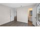 Bright bedroom with wood-look floors and ensuite bathroom at 1703 E Fern Rd, Lakeland, FL 33801