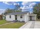 Newly painted house with driveway and landscaping at 1703 E Fern Rd, Lakeland, FL 33801