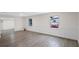 Living room with gray vinyl flooring and white wainscoting at 1703 E Fern Rd, Lakeland, FL 33801