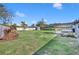 Landscaped backyard featuring a pergola and patio area at 2127 Lake Dr, Winter Park, FL 32789