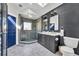 Modern bathroom with double vanity, a large walk-in shower, and stylish dark grey cabinetry at 2127 Lake Dr, Winter Park, FL 32789