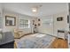 Well-lit bedroom with hardwood floors, a comfortable bed, and built-in shelving at 2127 Lake Dr, Winter Park, FL 32789