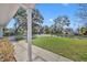 View from the porch, showcasing a well-maintained lawn and a tree-lined street at 2127 Lake Dr, Winter Park, FL 32789