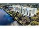 Aerial view of a waterfront condo building with parking and water access at 225 W Seminole Blvd # 412, Sanford, FL 32771