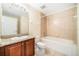 Clean bathroom with tub and granite vanity at 225 W Seminole Blvd # 412, Sanford, FL 32771