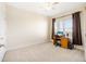 Condo bedroom with window and workspace at 225 W Seminole Blvd # 412, Sanford, FL 32771