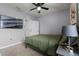 Comfortable bedroom with a large bed, TV, and side table at 229 Gina Ln, Davenport, FL 33837