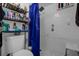 Small bathroom with shower stall, toilet and shelving unit at 2536 Lemon Tree Ln, Orlando, FL 32839