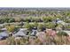 Aerial view of house and neighborhood, showcasing surrounding homes and landscape at 2647 Aloma Oaks Dr, Oviedo, FL 32765