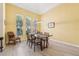 Elegant dining area bathed in natural light from large windows at 2647 Aloma Oaks Dr, Oviedo, FL 32765