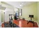 Home gym with wood floors and exercise equipment at 2647 Aloma Oaks Dr, Oviedo, FL 32765