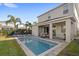 Private pool and patio area with lounge chairs and dining table at 266 Southfield St, Kissimmee, FL 34747