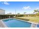 Inviting rectangular pool with grassy backyard and fence at 266 Southfield St, Kissimmee, FL 34747