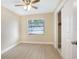 Bright bedroom with ceiling fan and window coverings at 2661 Ames Haven Rd, Kissimmee, FL 34744