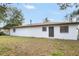 Single story home with brown door and neutral siding at 2661 Ames Haven Rd, Kissimmee, FL 34744