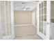 Room with French doors and neutral color palette at 2661 Ames Haven Rd, Kissimmee, FL 34744