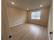 Bedroom with modern flooring and a window bringing in natural light at 2753 Redblush Ter, St Cloud, FL 34772