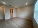 Sunlit bedroom with hard surface flooring, a neutral paint palette, and a modern aesthetic at 2753 Redblush Ter, St Cloud, FL 34772