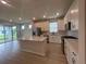 Modern kitchen with white cabinets, stainless steel appliances, and a center island at 2753 Redblush Ter, St Cloud, FL 34772