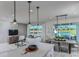 Bright, open-concept living and dining area with views of the lake, perfect for entertaining at 2753 Redblush Ter, St Cloud, FL 34772