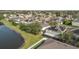 Aerial view of house and neighborhood near lake at 2760 Curpin Ln, Orlando, FL 32825