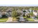 Aerial view of a neighborhood with lake access and solar panels on homes at 2760 Curpin Ln, Orlando, FL 32825