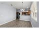 Bright dining area with tile flooring and view into kitchen at 2760 Curpin Ln, Orlando, FL 32825