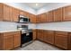 Modern kitchen with stainless steel appliances and light wood cabinets at 2760 Curpin Ln, Orlando, FL 32825