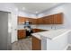 Modern kitchen with stainless steel appliances and light wood cabinets at 2760 Curpin Ln, Orlando, FL 32825