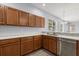 Modern kitchen with stainless steel appliances and light wood cabinets at 2760 Curpin Ln, Orlando, FL 32825