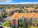 Exterior condo building view showcasing the property's location and surrounding landscape at 2821 Almaton Loop # 303, Kissimmee, FL 34747