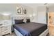 Spacious main bedroom with plush bed and en-suite bathroom access at 2821 Almaton Loop # 303, Kissimmee, FL 34747