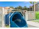 Blue body slide with safety rules posted nearby at 2821 Almaton Loop # 303, Kissimmee, FL 34747