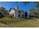 House with fenced backyard and a deck overlooking a tranquil lake at 3511 Exeter Ct, Orlando, FL 32812