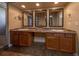 Double vanity bathroom with granite countertop and large mirrors at 3511 Exeter Ct, Orlando, FL 32812