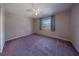 Bright bedroom with neutral walls and carpet at 3511 Exeter Ct, Orlando, FL 32812