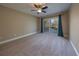 Bright bedroom with carpeting and sliding glass doors leading to a deck at 3511 Exeter Ct, Orlando, FL 32812