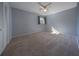 Bedroom with light walls, carpet, and a window with natural light at 3511 Exeter Ct, Orlando, FL 32812