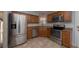 Modern kitchen featuring stainless steel appliances and granite countertops at 3511 Exeter Ct, Orlando, FL 32812