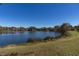 Peaceful lakefront view with homes in background at 3511 Exeter Ct, Orlando, FL 32812