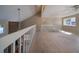 Open loft overlooking main living area, with carpeting and natural light at 3511 Exeter Ct, Orlando, FL 32812