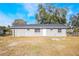 Newly painted gray single-story home with a spacious yard at 355 E Hoffman St, Lake Alfred, FL 33850