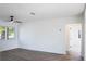 Living room with ceiling fan and wood-look floors at 355 E Hoffman St, Lake Alfred, FL 33850