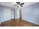 Bedroom with hardwood floors and double door closet at 36737 Antone Dr, Grand Island, FL 32735