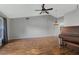 Spacious living room featuring hardwood floors and a ceiling fan at 36737 Antone Dr, Grand Island, FL 32735