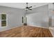 Spacious living room featuring hardwood floors and ceiling fan at 36737 Antone Dr, Grand Island, FL 32735