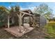 Covered patio with pergola and screened enclosure next to the pool at 36737 Antone Dr, Grand Island, FL 32735