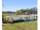 Ranch style home with a large yard and water view at 3710 Sutton Dr, Orlando, FL 32810