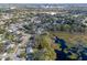 Aerial view showing home's proximity to a lake and surrounding houses at 3710 Sutton Dr, Orlando, FL 32810